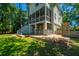 Outdoor living space featuring a backyard patio with comfortable seating, bar and lush green grass at 1971 N North Creek Dr, Mount Pleasant, SC 29466