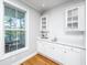 Bar area with white cabinetry and hardwood floors at 1971 N North Creek Dr, Mount Pleasant, SC 29466