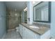 Modern bathroom featuring double sinks, granite countertops, and a luxurious tile shower at 1971 N North Creek Dr, Mount Pleasant, SC 29466