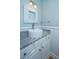 Bathroom featuring a vessel sink, marble countertop, decorative mirror, and beadboard at 1971 N North Creek Dr, Mount Pleasant, SC 29466