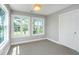 Bright bedroom with natural light, neutral walls, and views of a green landscape through the windows at 1971 N North Creek Dr, Mount Pleasant, SC 29466