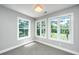 A sun-filled bedroom featuring beautiful windows with views of the surrounding lush landscape at 1971 N North Creek Dr, Mount Pleasant, SC 29466