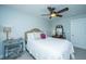 Cozy bedroom with a comfy bed, window with blinds, a ceiling fan, and side tables with lamps at 1971 N North Creek Dr, Mount Pleasant, SC 29466