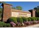 A brick sign for Rivertowne Country Club featuring lush landscaping at 1971 N North Creek Dr, Mount Pleasant, SC 29466