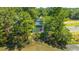 Waterfront home with dual balconies, verdant landscaping, steps to backyard, and view of tranquil pond at 1971 N North Creek Dr, Mount Pleasant, SC 29466