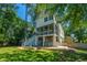 Backyard view of a charming two-story home with ample outdoor entertaining space at 1971 N North Creek Dr, Mount Pleasant, SC 29466