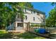 Charming two-story home with a kayak on the property and stairs leading to a screened-in porch at 1971 N North Creek Dr, Mount Pleasant, SC 29466