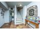 Welcoming foyer with tile flooring, a staircase, and decorative accents, creating a charming entryway at 1971 N North Creek Dr, Mount Pleasant, SC 29466