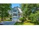 Attractive home with a well-manicured lawn, a charming porch, and ample parking, showcasing curb appeal at 1971 N North Creek Dr, Mount Pleasant, SC 29466