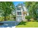 Charming two-story home with white siding, a well-manicured lawn, and a welcoming front porch at 1971 N North Creek Dr, Mount Pleasant, SC 29466