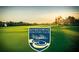 A beautifully manicured golf course with a welcoming sign for Rivertowne Country Club at 1971 N North Creek Dr, Mount Pleasant, SC 29466