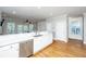Bright kitchen with stainless steel appliances, white cabinetry, and hardwood floors at 1971 N North Creek Dr, Mount Pleasant, SC 29466