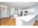 Open concept kitchen with white countertops, stainless appliances, and hardwood floors at 1971 N North Creek Dr, Mount Pleasant, SC 29466