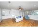 Spacious living room with hardwood flooring, a fireplace, and white walls at 1971 N North Creek Dr, Mount Pleasant, SC 29466