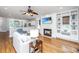 Open living area with a fireplace, TV, and kitchen view at 1971 N North Creek Dr, Mount Pleasant, SC 29466