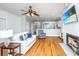 Inviting living room with hardwood floors, a fireplace, and plenty of natural light at 1971 N North Creek Dr, Mount Pleasant, SC 29466