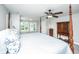 Comfortable bedroom with a four-poster bed, neutral decor, and great natural light at 1971 N North Creek Dr, Mount Pleasant, SC 29466