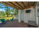 Inviting outdoor living space with comfortable seating, a fire pit, and a view of the serene backyard at 1971 N North Creek Dr, Mount Pleasant, SC 29466