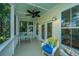 Relaxing screened-in porch featuring comfortable seating, ceiling fan, and natural light at 1971 N North Creek Dr, Mount Pleasant, SC 29466