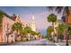 Charming street view featuring historic buildings, lush palm trees, and a prominent church steeple against a colorful sky at 1971 N North Creek Dr, Mount Pleasant, SC 29466