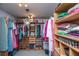 Spacious walk-in closet with custom shelving, hanging rods, and ample storage for clothes, shoes, and accessories at 1971 N North Creek Dr, Mount Pleasant, SC 29466
