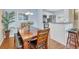 Bright dining area featuring a wood table and easy access to the modern kitchen at 2011 N Highway 17 # 1900G, Mount Pleasant, SC 29466