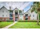 Charming condominium complex featuring brick accents, a well-manicured lawn, and lush landscaping at 2011 N Highway 17 # 1900G, Mount Pleasant, SC 29466