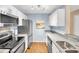 Well-lit kitchen with stainless steel appliances, ample countertop space, and modern cabinetry at 2011 N Highway 17 # 1900G, Mount Pleasant, SC 29466