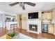 Inviting living room featuring a cozy fireplace, ceiling fan, and hardwood flooring at 2011 N Highway 17 # 1900G, Mount Pleasant, SC 29466