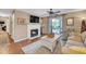 Inviting living room featuring a fireplace, ceiling fan, and sliding glass doors to the balcony at 2011 N Highway 17 # 1900G, Mount Pleasant, SC 29466