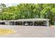 Open carport parking area with multiple parking spaces available amidst lush green surroundings at 2011 N Highway 17 # 1900G, Mount Pleasant, SC 29466
