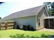 Low-maintenance backyard featuring verdant lawn, privacy fence, and mature trees at 207 Short Woods Ct, Summerville, SC 29486
