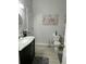 The bathroom features neutral walls, a toilet, and a dark wood vanity with marble countertop at 207 Short Woods Ct, Summerville, SC 29486