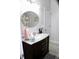 Bathroom featuring a round mirror and vanity with marble countertop at 207 Short Woods Ct, Summerville, SC 29486