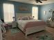 Bright bedroom with a cozy white bed, decorated with pastel accents and artwork at 207 Short Woods Ct, Summerville, SC 29486