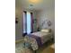 The bedroom boasts a charming decor with purple accents and a comfortable single bed at 207 Short Woods Ct, Summerville, SC 29486