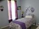 Bedroom showcasing a twin bed with purple accents, a window, and wall decor at 207 Short Woods Ct, Summerville, SC 29486
