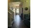Inviting foyer with dark wood floors, white walls, and a view of the front door at 207 Short Woods Ct, Summerville, SC 29486