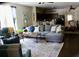 Open living room with a comfortable seating area and an adjacent kitchen and dining room at 207 Short Woods Ct, Summerville, SC 29486
