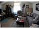 Cozy living room featuring comfortable seating, a coffee table, and a display cabinet at 207 Short Woods Ct, Summerville, SC 29486