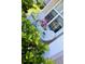 Cozy porch with two white wicker chairs and green bushes at 207 Short Woods Ct, Summerville, SC 29486