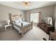 Comfortable bedroom featuring carpet floors, neutral paint and a large bed with a decorative headboard at 213 Ashmont Dr, Wando, SC 29492