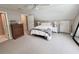 A bright bedroom with a plush carpet, a bed, and natural light at 213 Ashmont Dr, Wando, SC 29492