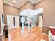 Elegant foyer with hardwood floors, soaring ceilings, and a view into the dining room at 213 Ashmont Dr, Wando, SC 29492