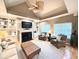 Living room showcases built-in shelving, a cozy fireplace, and a comfortable seating area at 213 Ashmont Dr, Wando, SC 29492