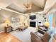 Well-lit living room boasts a fireplace, stylish furniture, and comfortable seating arrangements at 213 Ashmont Dr, Wando, SC 29492