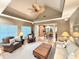 Bright and airy living room featuring vaulted ceilings, ceiling fan, and views of the kitchen at 213 Ashmont Dr, Wando, SC 29492