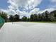 Outdoor tennis court surrounded by fencing and greenery at 213 Ashmont Dr, Wando, SC 29492