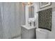 Modern bathroom featuring sleek vanity, stylish shower curtain, and contemporary fixtures for a fresh, clean aesthetic at 2215 Suffolk St, North Charleston, SC 29405