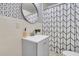 Stylish bathroom featuring modern vanity with decorative mirror and patterned shower curtain at 2215 Suffolk St, North Charleston, SC 29405